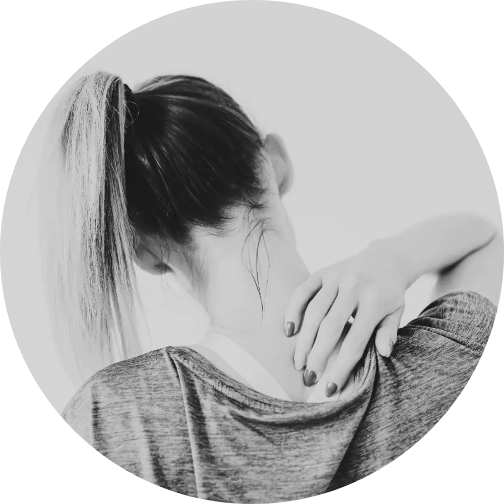 woman holding hand on her back